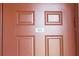 Close up of the brown front door, numbered 205 at 7803 Grand Estuary Trl # 205, Bradenton, FL 34212