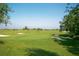 Expansive golf course view featuring manicured greens, sand traps, and blue skies at 7803 Grand Estuary Trl # 205, Bradenton, FL 34212
