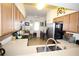 Bright kitchen featuring stainless steel appliances, eat in area, and light wood cabinets at 7803 Grand Estuary Trl # 205, Bradenton, FL 34212