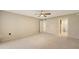 Spacious bedroom with neutral walls, carpet and a ceiling fan at 811 Oak Dr # 811, Bradenton, FL 34210