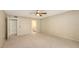 This bedroom features neutral walls, carpet, and a ceiling fan for added comfort at 811 Oak Dr # 811, Bradenton, FL 34210
