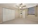 Bedroom with neutral walls, carpet, a closet and an exterior window at 811 Oak Dr # 811, Bradenton, FL 34210