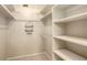 Walk-in closet with carpet, neutral paint and white shelving at 811 Oak Dr # 811, Bradenton, FL 34210