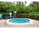 Community hot tub surrounded by lush greenery provides a peaceful and relaxing retreat at 811 Oak Dr # 811, Bradenton, FL 34210