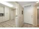Bright kitchen featuring tile flooring, white cabinetry, and stainless steel appliances at 811 Oak Dr # 811, Bradenton, FL 34210