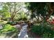 Beautiful landscaping on walking path with mature trees at 811 Oak Dr # 811, Bradenton, FL 34210