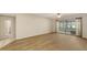 Open living room with access to the screened porch and tiled hallway at 811 Oak Dr # 811, Bradenton, FL 34210