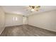 Inviting living room with ceiling fan, light walls, and wood floors at 811 Oak Dr # 811, Bradenton, FL 34210