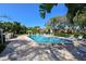 Outdoor community pool and spa surrounded by lounge chairs and greenery, ideal for relaxation and recreation at 811 Oak Dr # 811, Bradenton, FL 34210