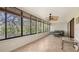 Cozy sunroom with furniture, large windows, and tile flooring at 811 Oak Dr # 811, Bradenton, FL 34210