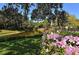 Calming water view is accented by gorgeous pink flowers in the foreground at 811 Oak Dr # 811, Bradenton, FL 34210