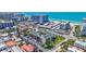 Expansive aerial view showcases the building, nearby residences, beach and the vibrant coastal setting at 845 Benjamin Franklin Dr # 106, Sarasota, FL 34236