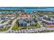 Aerial view of condo building showcasing the pool and nearby waterways at 845 Benjamin Franklin Dr # 106, Sarasota, FL 34236