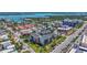 Birds-eye view of a building complex surrounded by tropical landscaping, street, and neighborhood at 845 Benjamin Franklin Dr # 106, Sarasota, FL 34236