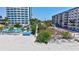 Direct beach access with turquoise water and palm trees, showcasing the ultimate beachfront lifestyle at 845 Benjamin Franklin Dr # 106, Sarasota, FL 34236