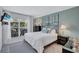 Bright bedroom features a stylish bed frame, ample natural light, and a calming color scheme at 845 Benjamin Franklin Dr # 106, Sarasota, FL 34236
