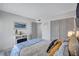 Comfortable bedroom featuring a fireplace, nautical decor, and neutral paint tones at 845 Benjamin Franklin Dr # 106, Sarasota, FL 34236