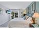 Bright bedroom features a stylish bed frame, ample natural light, and a calming color scheme at 845 Benjamin Franklin Dr # 106, Sarasota, FL 34236