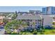 Beautiful exterior of the residential building with well-maintained landscaping and ample parking at 845 Benjamin Franklin Dr # 106, Sarasota, FL 34236