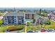 Exterior condo shot including the pool and lovely green space at 845 Benjamin Franklin Dr # 106, Sarasota, FL 34236