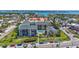 Beautiful condo exterior featuring lush landscaping and a sparkling swimming pool at 845 Benjamin Franklin Dr # 106, Sarasota, FL 34236