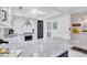 Bright and airy kitchen with white cabinets and granite countertops at 845 Benjamin Franklin Dr # 106, Sarasota, FL 34236