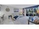 Relaxing living room features stylish decor, a comfortable couch, and plenty of natural light at 845 Benjamin Franklin Dr # 106, Sarasota, FL 34236