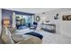 Comfortable living room with stylish furnishings, decor, and direct access to the lanai at 845 Benjamin Franklin Dr # 106, Sarasota, FL 34236