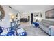 Bright open living space with nautical decor, modern furnishings and sight lines into the kitchen at 845 Benjamin Franklin Dr # 106, Sarasota, FL 34236