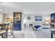 Bright, open concept living space with modern furnishings and elegant nautical accents throughout at 845 Benjamin Franklin Dr # 106, Sarasota, FL 34236