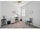 Simple bedroom featuring a desk and modern decor at 8553 Whispering St, Sarasota, FL 34240