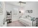 Comfortable bedroom with a metal bed frame, soft lighting, and neutral decor at 8553 Whispering St, Sarasota, FL 34240