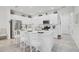 Bright kitchen with a large island, stainless steel appliances, and ample cabinet space at 8553 Whispering St, Sarasota, FL 34240