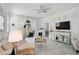 Living room with white walls, neutral furniture, and a view of the backyard at 8553 Whispering St, Sarasota, FL 34240
