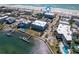 Drone shot displaying the real estate's location near the beach, pool, tennis court and docking facilities at 901 Gulf S Dr # 3, Bradenton Beach, FL 34217