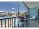 Balcony seating overlooks the pool, hot tub, tennis court and community grounds at 901 Gulf S Dr # 3, Bradenton Beach, FL 34217
