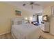 Cozy bedroom with queen bed, sofa, and balcony access, providing comfortable living space at 901 Gulf S Dr # 3, Bradenton Beach, FL 34217