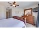 Comfortable bedroom with a large dresser, a mounted TV and an inviting queen size bed at 901 Gulf S Dr # 3, Bradenton Beach, FL 34217