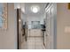 Galley kitchen with stainless steel appliances, white cabinets, and tiled backsplash at 901 Gulf S Dr # 3, Bradenton Beach, FL 34217