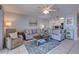 Comfortable living room open to kitchen with stylish decor and plenty of light at 901 Gulf S Dr # 3, Bradenton Beach, FL 34217