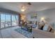 Comfortable living room with tile floors, slider to balcony and partial ocean views at 901 Gulf S Dr # 3, Bradenton Beach, FL 34217