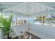 A serene beachfront balcony offers breathtaking views of the ocean and a calming ambiance at 9265 Blind Pass Rd, Sarasota, FL 34242