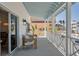 Inviting porch with comfortable seating, and ocean view, perfect for relaxation and enjoying the coastal breeze at 9265 Blind Pass Rd, Sarasota, FL 34242