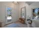 Inviting entryway with beach views, decor accents and white walls, creating a bright, airy welcome at 9265 Blind Pass Rd, Sarasota, FL 34242