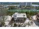 Coastal home with a unique tower design surrounded by sandy beach and lush greenery at 9265 Blind Pass Rd, Sarasota, FL 34242