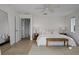 Bright bedroom with neutral tones, natural light, and an ensuite bathroom with modern fixtures at 9265 Blind Pass Rd, Sarasota, FL 34242