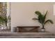 Charming porch features a wooden bench, potted plants, and classic architectural details, creating a welcoming entryway at 9265 Blind Pass Rd, Sarasota, FL 34242