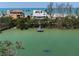 Beautiful waterfront property featuring lush foliage and a private dock perfect for relaxation at 9265 Blind Pass Rd, Sarasota, FL 34242