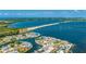 Stunning aerial view of waterfront home with private dock on beautiful blue bay near a beach at 10008 Spoonbill E Rd, Bradenton, FL 34209