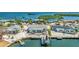 Waterfront property showcasing the home's backyard, boat dock, and waterfront access at 10008 Spoonbill E Rd, Bradenton, FL 34209